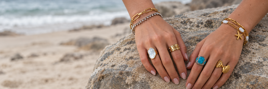 Sea Nymphs rings and bracelets styled naturally at the beach.