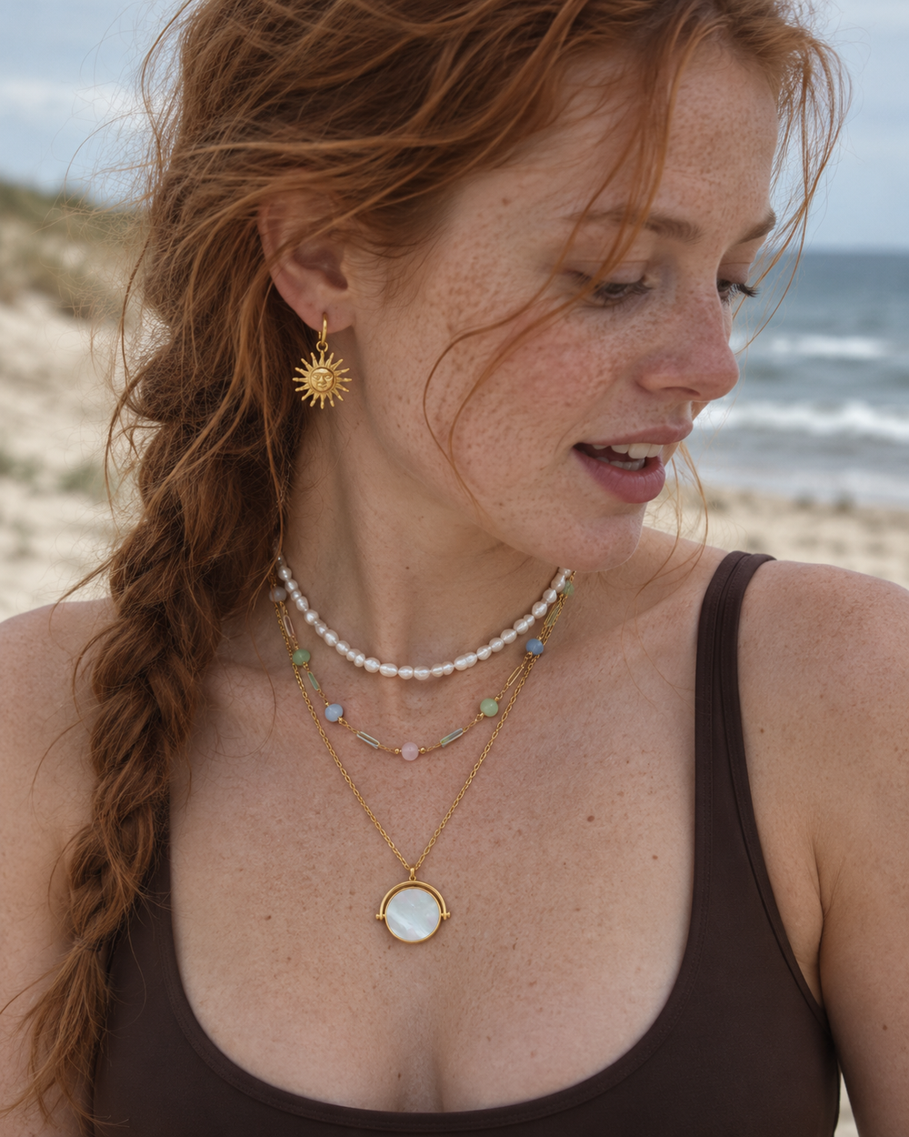 Sea Nymphs jewellery worn in a natural beachside lifestyle photograph.