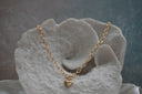 Alternate view: gold-tone oval-link necklace with a front bar-and-ring detail and a smooth heart charm.