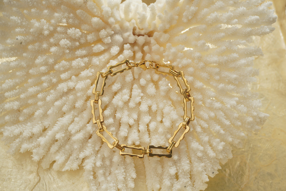 Alternate view: gold-tone bracelet with open rectangular links, scalloped edges and smaller oval connectors.