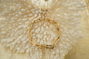 Alternate view: gold-tone bracelet with open rectangular links, scalloped edges and smaller oval connectors.