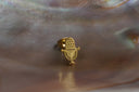 Alternate view: gold-tone microphone-shaped stud earrings with dotted grille details and curved stand outlines.