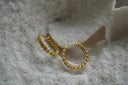 Gold-tone circular hoop earrings with an interlocking chain-link texture.