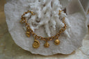 Alternate view: gold-tone oval-link bracelet with strawberry, fish and shell charms.