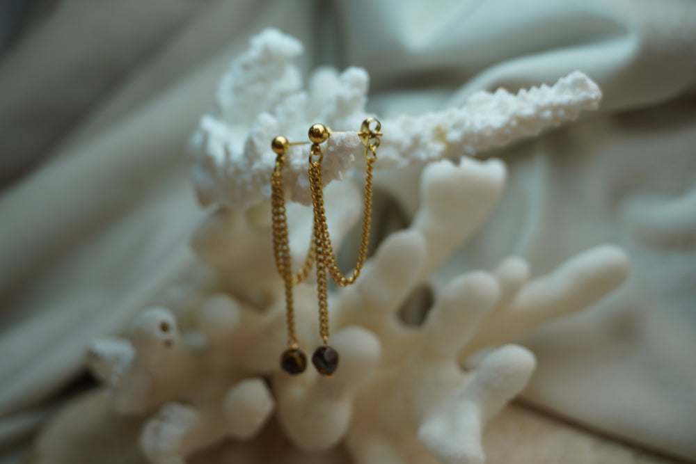 Alternate view: gold-tone ball-stud earrings with draped chain loops and long drops ending in dark brown faceted beads.