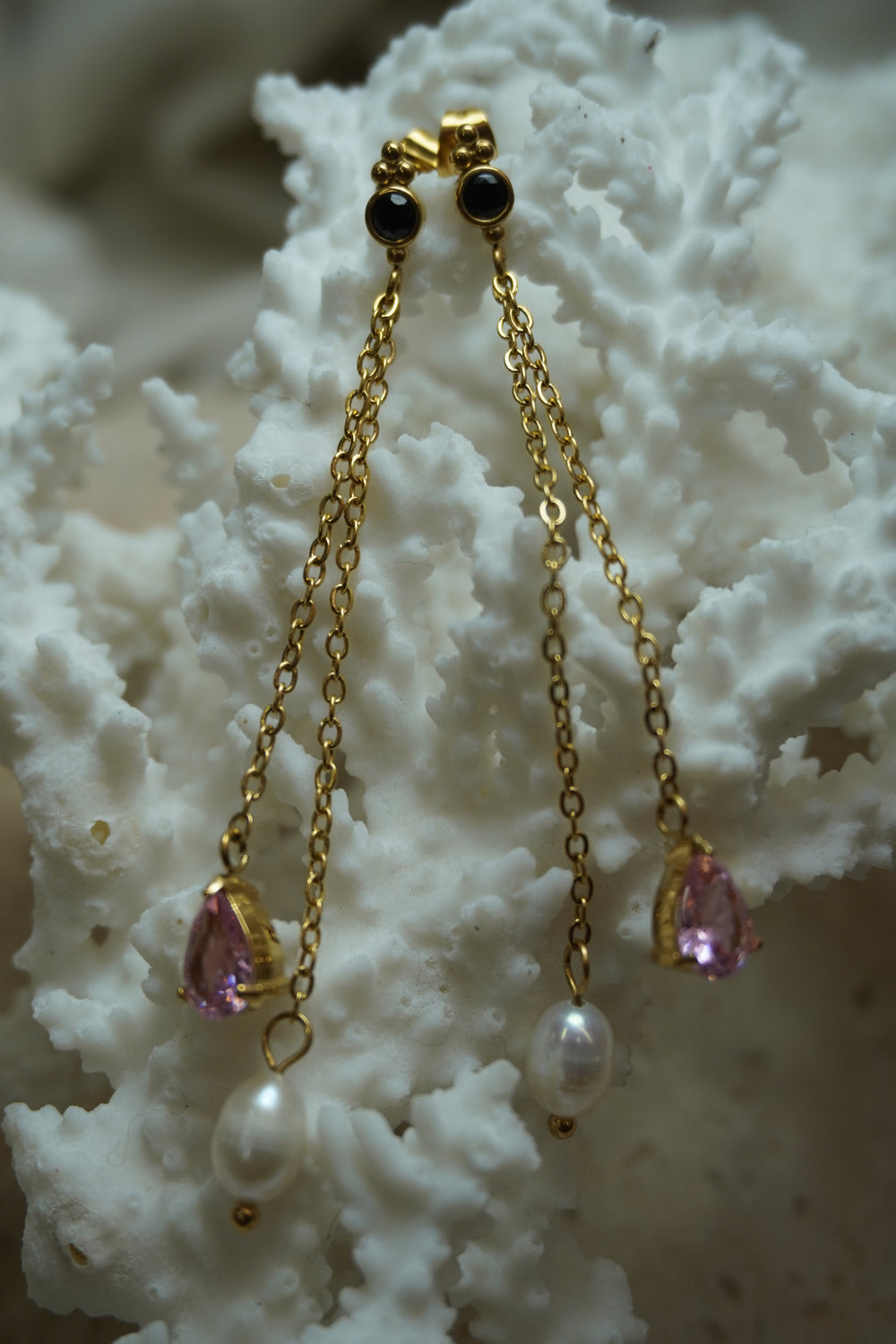 Alternate view: long gold-tone chain earrings with dark round stud tops, pink faceted teardrops and white oval beads.