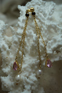 Alternate view: long gold-tone chain earrings with dark round stud tops, pink faceted teardrops and white oval beads.