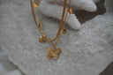 Alternate view: layered gold-tone necklace with a large detailed butterfly, smaller butterfly charms and a flat upper strand.