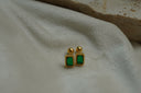 Alternate view: gold-tone rectangular studs with green faceted centres, ribbed borders, straight posts and ball backs.