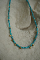 Alternate view: blue-green beaded necklace with spaced gold-tone round accents.