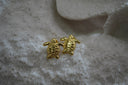 Alternate view: gold-tone turtle stud earrings with patterned bodies and outstretched flippers.