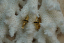 Gold-tone hoops with ridged sections and disc-like collars edged with dark accents.