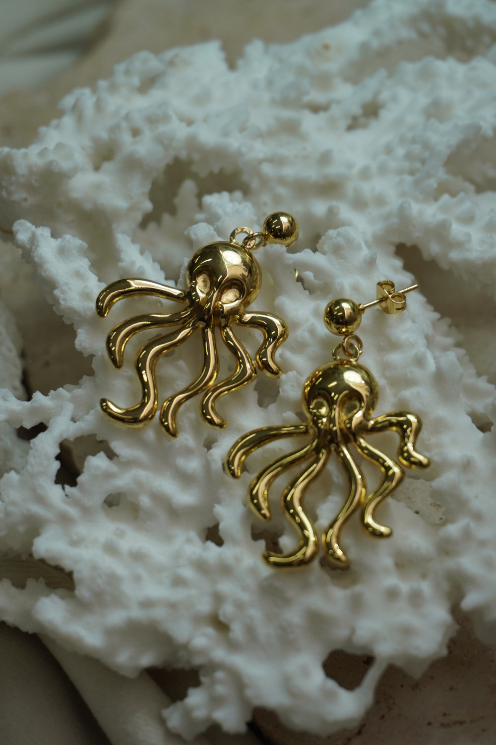 Alternate view: gold-tone octopus drop earrings with curling tentacles beneath smooth ball studs.