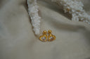 Alternate view: gold-tone heart studs with clear faceted heart-shaped centres and smooth borders.
