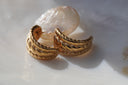 Alternate view: gold-tone open hoop earrings with three rows of rounded diagonal ridges.