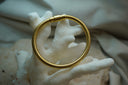 Alternate view: gold-tone ribbed bracelet with a smooth cylindrical clasp.