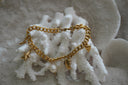Alternate view: gold-tone curb-chain bracelet with starfish, shell motifs and a white oval drop.