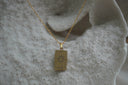 Alternate view: gold-tone necklace with a rectangular The Sun pendant, sun-face illustration, pointed rays and XIX lettering.