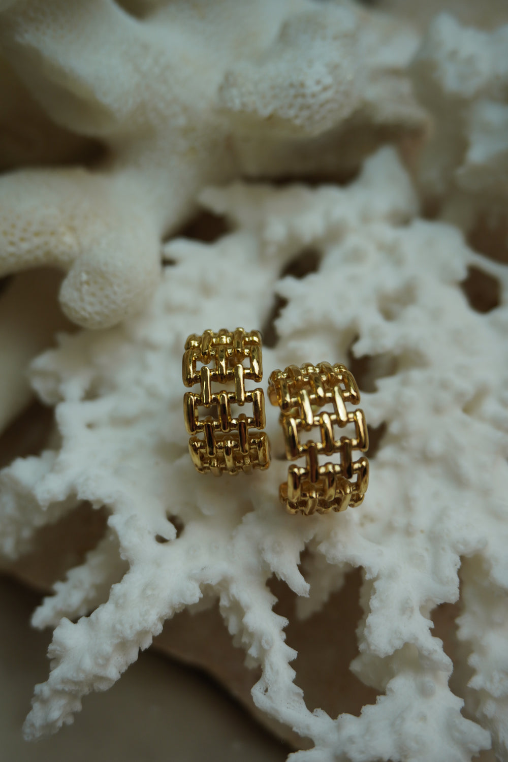 Alternate view: broad open gold-tone hoop earrings with a rectangular link lattice and visible post backs.