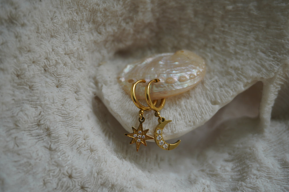 Alternate view: gold-tone hoop earrings with a clear-accented star and crescent moon charm.