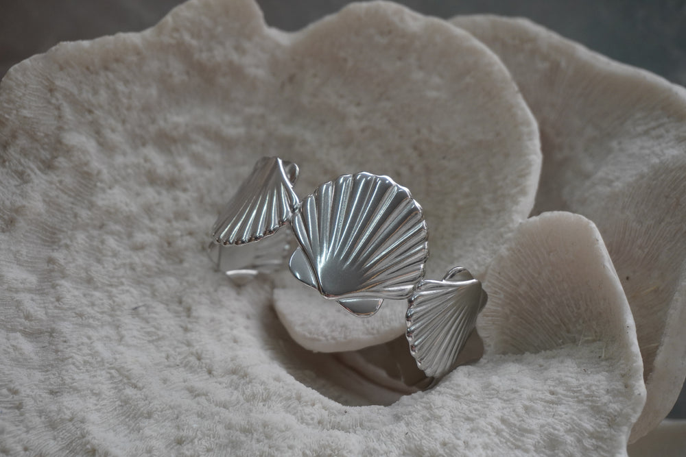 Alternate view: silver-tone cuff with large ridged fan-shell forms.