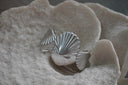 Alternate view: silver-tone cuff with large ridged fan-shell forms.