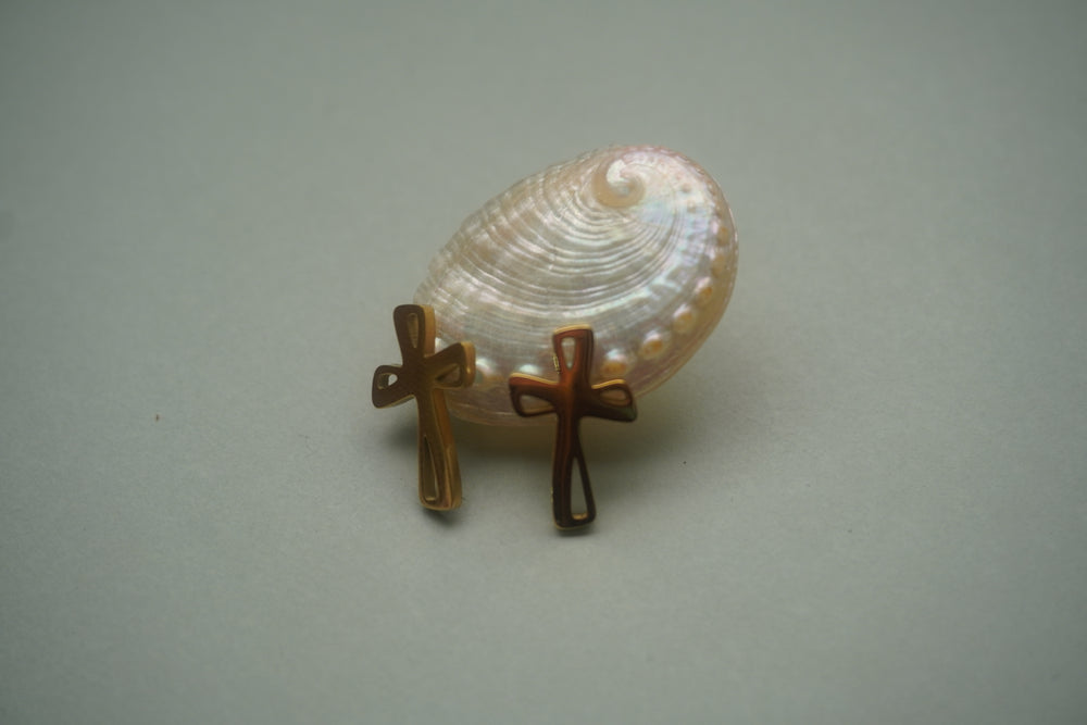 Alternate view: gold-tone cross stud earrings with rounded ends and elongated cutouts.