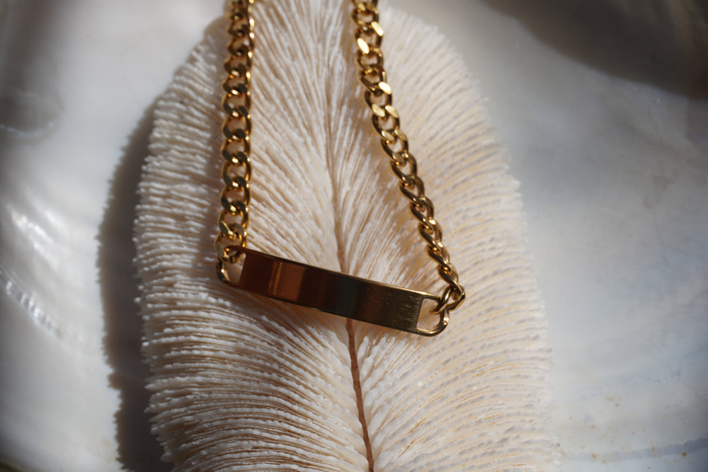 Alternate view: gold-tone chain bracelet with a plain rectangular centre bar.