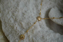 Alternate view: gold-tone Y necklace with sunburst motifs and small round beads along a fine chain.