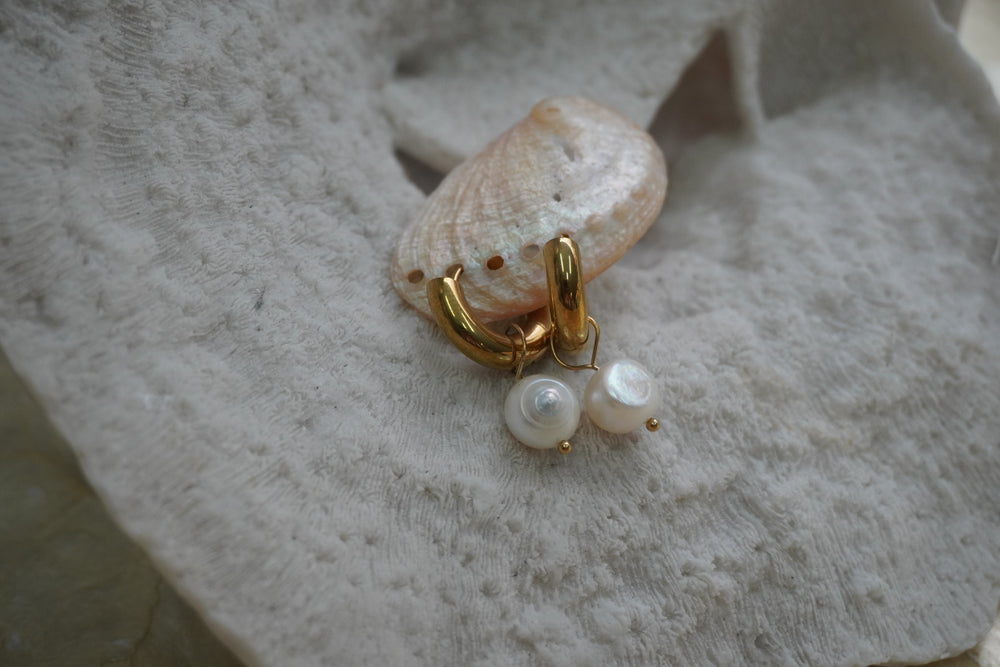Alternate view: gold-tone smooth hoops with rounded white bead drops and small gold-tone tips.