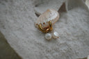 Alternate view: gold-tone smooth hoops with rounded white bead drops and small gold-tone tips.
