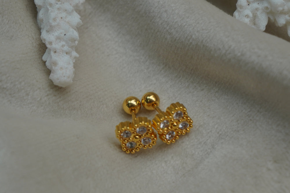 Alternate view: gold-tone square studs with four round faceted accents, dotted borders and ribbed edges.