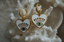 Alternate view: gold-tone hoops with white heart charms, blue eye motifs and multicoloured accents.