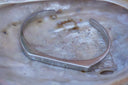 Silver-tone open cuff with an angular flattened front and curved sides.