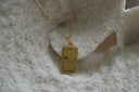 Alternate view: gold-tone necklace with a rectangular Judgement pendant, curved horn, constellation lines and XX lettering.