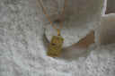 Gold-tone necklace with a rectangular Judgement pendant, curved horn, constellation lines and XX lettering.