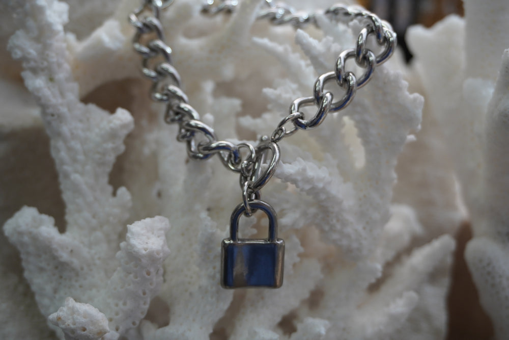 Alternate view: silver-tone curb-link bracelet with a padlock charm and ring-and-bar clasp.