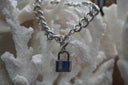 Alternate view: silver-tone curb-link bracelet with a padlock charm and ring-and-bar clasp.