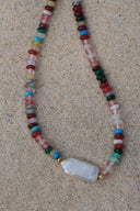Festival Tide Bead Necklace laid out to show the coloured beads and pale rectangular centrepiece.