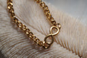 Alternate view: gold-tone chain bracelet with an open infinity-shaped centrepiece.