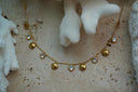 Alternate view: gold-tone fine chain necklace with alternating small shell motifs and clear round accents in gold-tone borders.