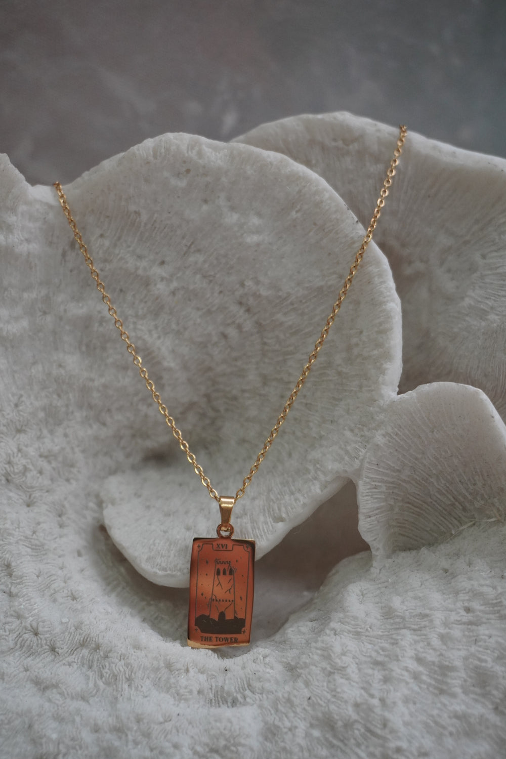 Alternate view: gold-tone necklace with a rectangular The Tower pendant, cracked tower illustration and XVI lettering.