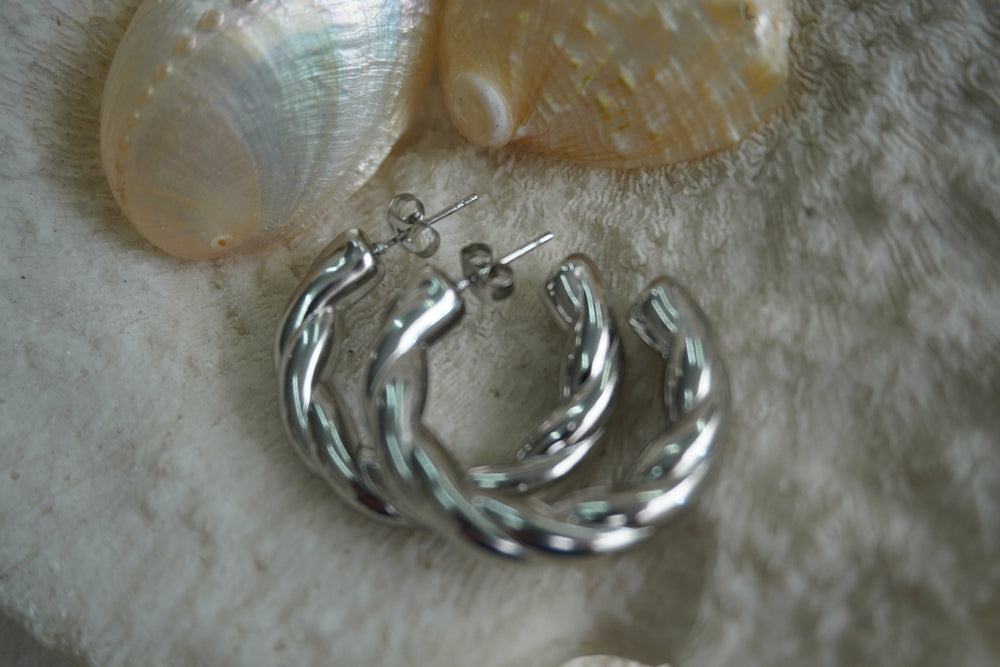 Alternate view: silver-tone open hoop earrings with two broad, smooth twisted strands.