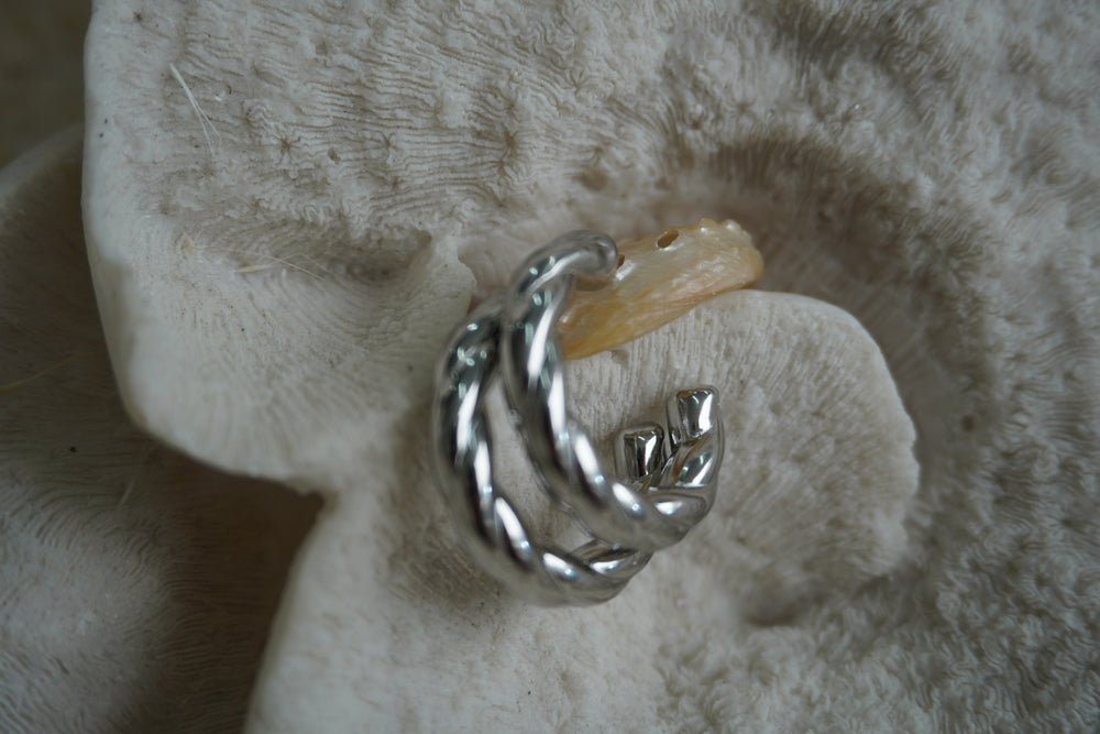 Silver-tone open hoop earrings with two broad, smooth twisted strands.