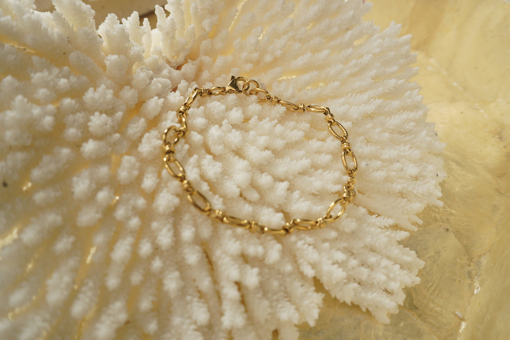 Alternate view: gold-tone bracelet with fine oval links, small ridged connectors and a clasp.