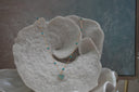 Alternate view: gold-tone necklace with spaced blue beads and a heart pendant covered in small blue circular accents.