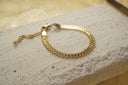 Alternate view: gold-tone bracelet with ridged rectangular panels, looped edges and an extension chain.
