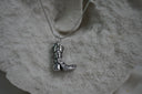 Alternate view: silver-tone necklace with a western boot pendant featuring raised scroll details and a pointed toe.