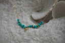 Alternate view: gold-tone necklace with elongated links, irregular turquoise-coloured beads and a small heart charm.