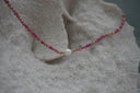 Alternate view: pink beaded necklace with gold-tone accents and a white centre bead.